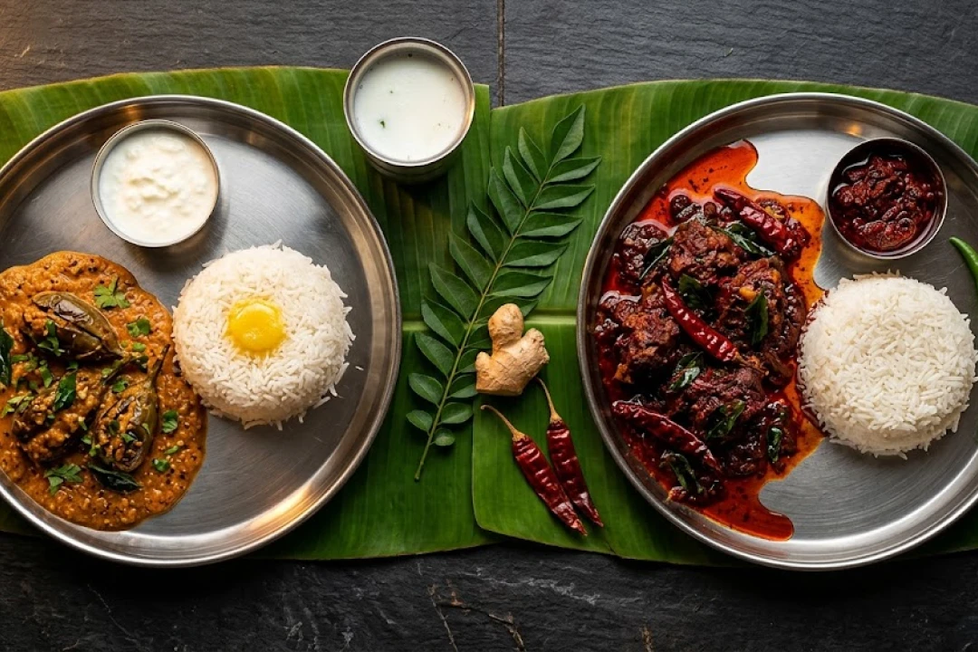 Andhra spice spectrum — mild gutti vankaya kura vs spicy gongura mamsam side-by-side at Nandhini Deluxe Bangalore