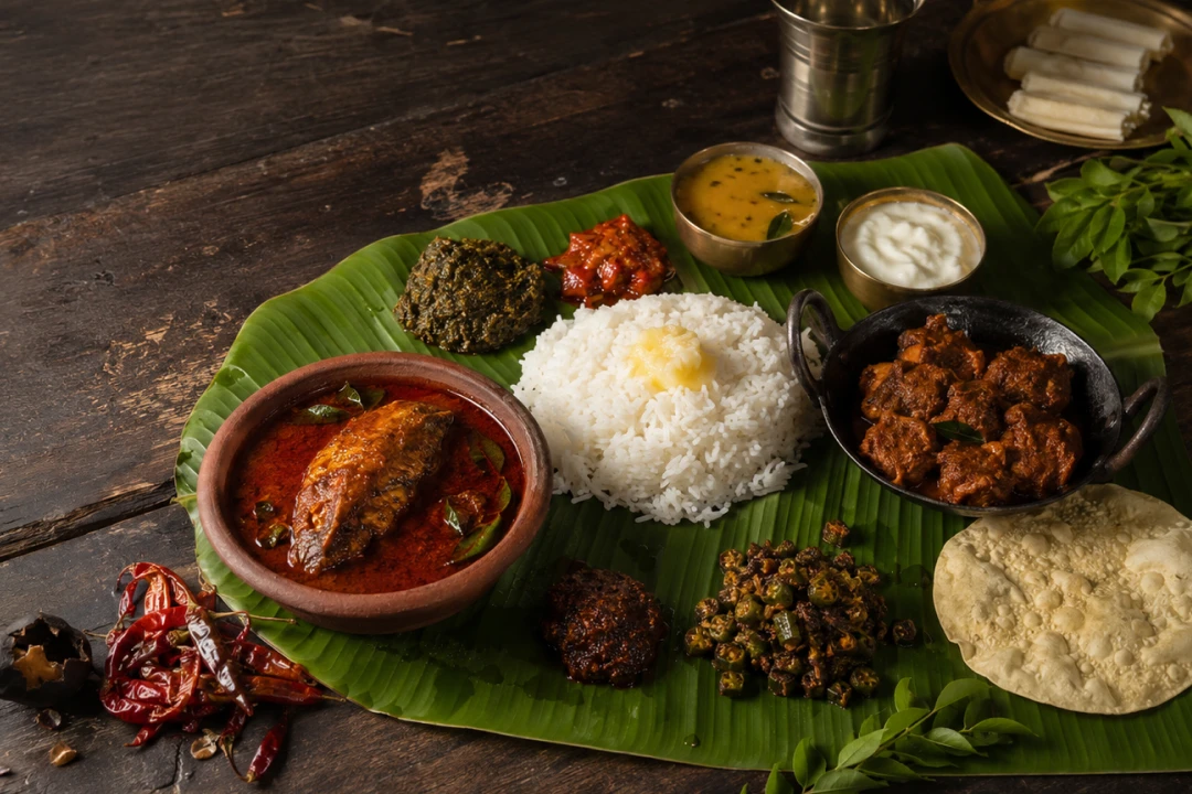 Famous foods of Andhra Pradesh on a banana leaf – fish curry, rice, mutton, papad and pickles